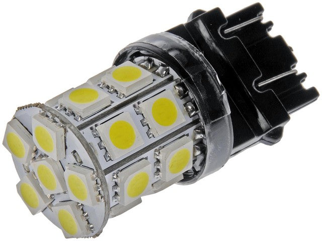 Dorman Back Up Light Bulb,Center High Mount Stop Light Bulb,Tail Light Bulb P/N:3157W-SMD Fits: BMW 528i, BMW 540i, Buick Lesabre, Buick Regal, Buick Rendezvous, Cadillac Cts, Cadillac Deville, Cadillac Escalade, Cadillac Seville, Chevrolet Avalanche 1500 - Image 1